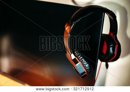 Headphones On Black Empty Monitor, Space For Text