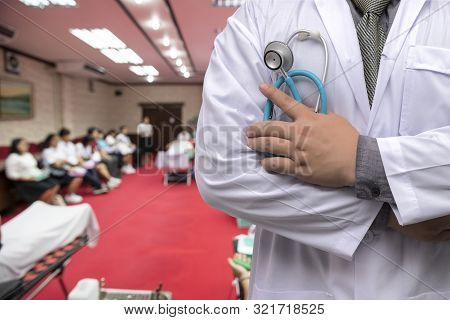 Doctor In Gown Uniform With Stethoscope Standing And Fold His Arms Over The Chest In Blood Donor Roo