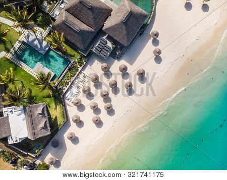 Aerial View Of Amazing Tropical White Sandy Beach With Palm Leaves Umbrellas And Turquoise Sea, Maur