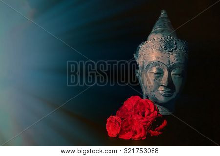 Peace And Love. Traditional Meditating Buddha Head With Red Roses Isolated On Black Background With 