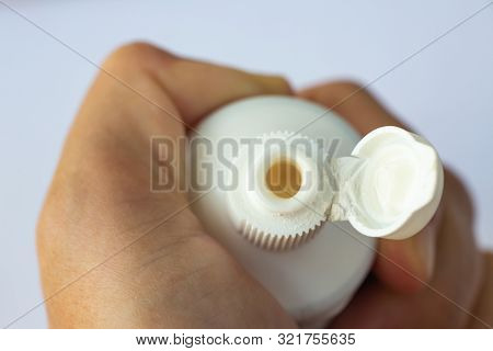 Woman's Hands Squeezing Toothpaste On White Background, Close Up & Macro Shot, Selective Focus, Heal