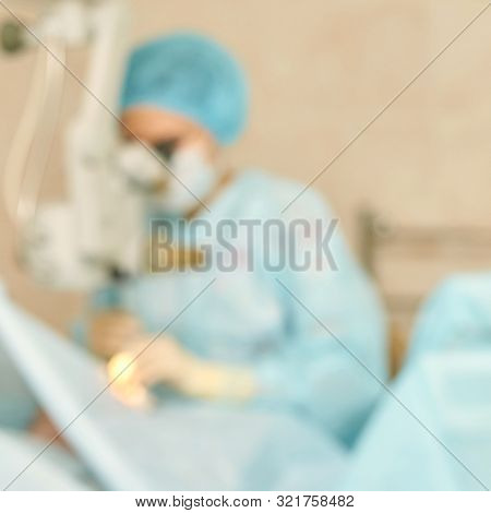 Ophthalmology Laser Microscope Operation. Clinic Room With Doctor And Parient. Blur Background. Unfo