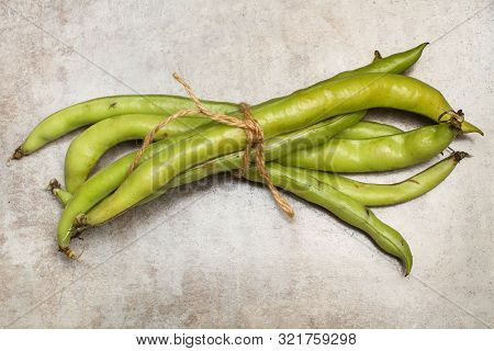 Tied Broad Beans On A Marble Table