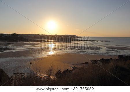 Le Loch Cove And Harbor In Primelin At Sunrise