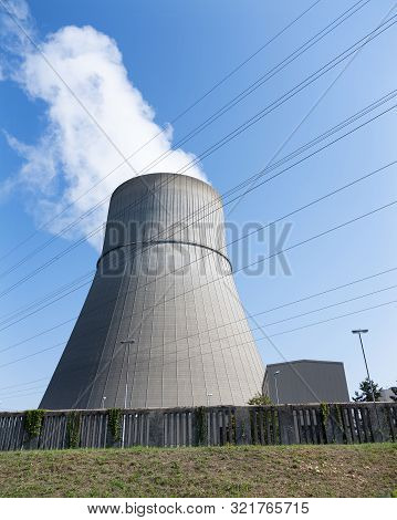 Steam And Blue Sky Above Large Chimney Of Nuclear Power Plant Near German Town Lingen In Lower Saxon