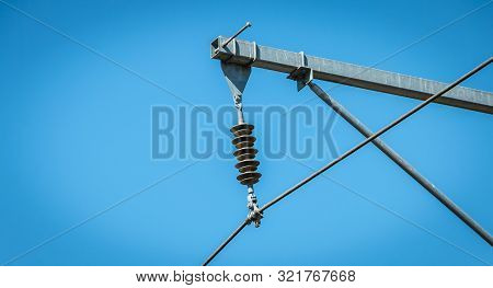 Closeup Of A Catenary On A Background Of Blue Sky In France