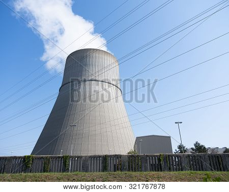 Steam And Blue Sky Above Large Chimney Of Nuclear Power Plant Near German Town Lingen In Lower Saxon