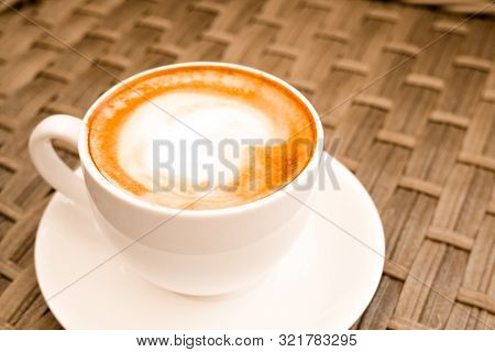 Cappuccino In White Cup On Wood Table Background At Cafe. Place For Text. Bewerages, Coffee Lovers A