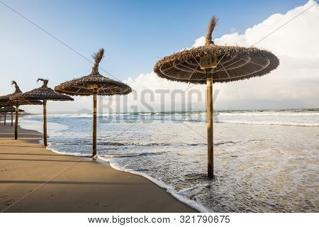 Flooded Umbrellas On The Beach Of Mallorca, Can Picafort City