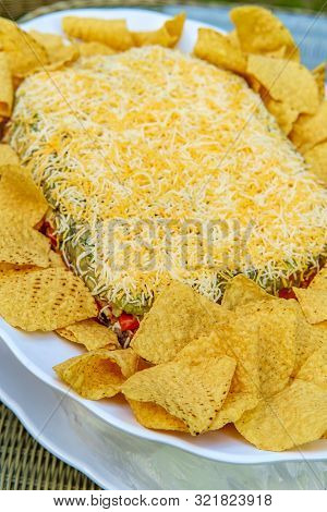 Tortilla Chips With 7 Layer Bean Dip For Outdoor Picnic Party Appetizer