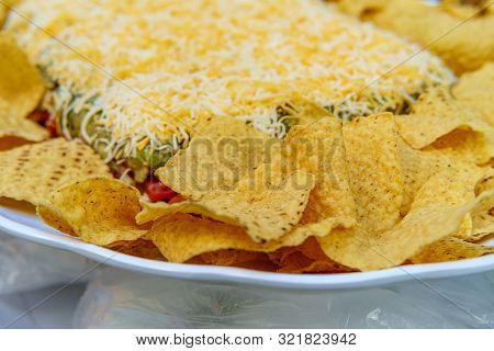 Tortilla Chips With 7 Layer Bean Dip For Outdoor Picnic Party Appetizer