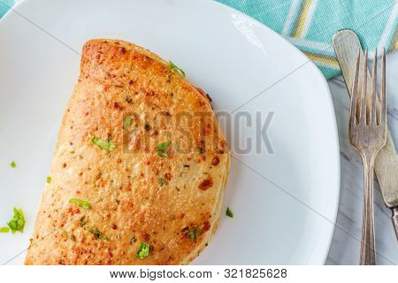 Italian Pastry Pepperoni And Cheese Calzone With Tomato Marinara Dipping Sauce