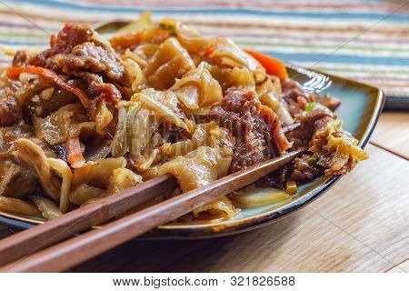 Stir Fried Chinese Beef Chow Fun With Hor Fun Wide Rice Noodles Cabbage And Carrots