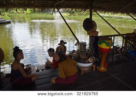 Kanchanaburi, Thailand, 09.09.2019: Local Thai People In Traditional Thai, Siamese Dresses Are Resti