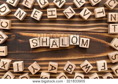 Shalom - Word From Wooden Blocks With Letters, Jewish Greeting Or Saying Goodbye Concept, Random Let