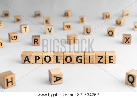 Apologize - Word From Wooden Blocks With Letters, Sorry Concept, Random Letters Around, White  Backg