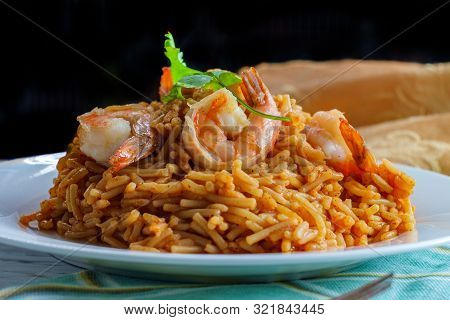 Tail-on Shrimp Spanish Rice With Vermicelli Pasta On Marble Kitchen Table