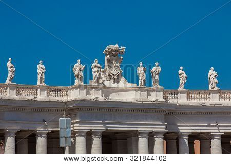 Detail Of The Chigi Coats Of Arms And The Statues Of Saints That Crown The Colonnades Of St. Peter S