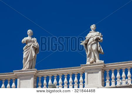 Detail Of The Statues Of Saints That Crown The Colonnades Of St. Peter Square Built On 1667 On The V