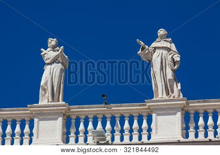 Detail Of The Statues Of Saints That Crown The Colonnades Of St. Peter Square Built On 1667 On The V