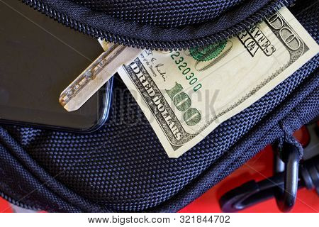 The Possibility Of Theft And Problems Of Dementia. The Unzipped Dark Bag From Which The Smartphone, 