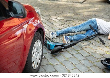 Man After Accident On Electric Scooter Overrun By Car
