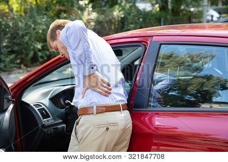 Driver Standing Having Backpain After Driving Car
