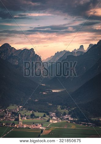 View Of Dobbiaco Lake And Surrounding Mountains. Dolomites, Italy