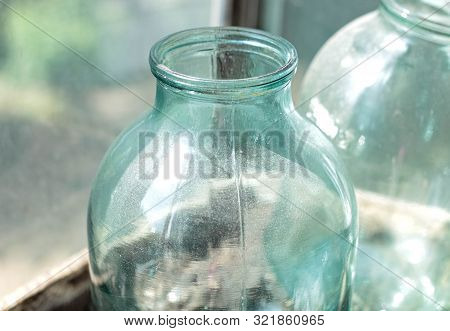 An Empty Three-liter Jar In The Dust Closeup. Dishes For Canning.