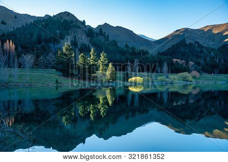 The Stunning Reflections And Scenery In The Grounds Of Lake Benmore Power Station Innew Zealand