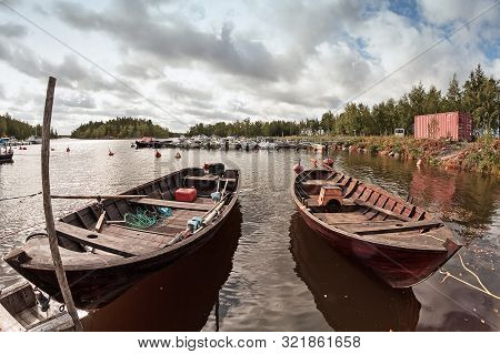 Two Old Wooden Fishing Boats Wait For The Fishermen At The Harbour Of Kalajoki, Finland. These Tradi