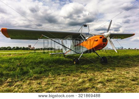 KALININGRAD, Russia - August 18, 2019: 100 Anniversary First European Airport Devau Fest, Ultra Light Propeller Screw Plane Ready for Flight