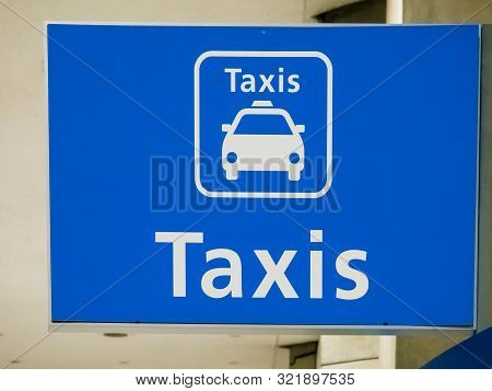 Blue Taxi Sign Board At Paris Airport, France