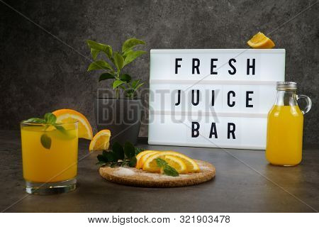 Fresh Juice Bar Concept. Oranges With Fresh Orange Juice