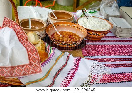 Traditional Ukrainian Garlic Bread (pampushky) And Dumpling Sauces (sour Cream, Melted Butter, Fried