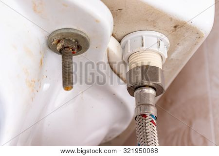 Water Supply Fitting Of Cistern Tank Of The Toilet Bowl At Water Closet Close Up