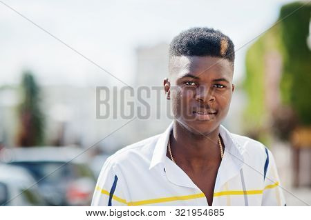 Portrait Of Handsome Stylish African American Model Man In Red Throusers And White Shirt Posed At St