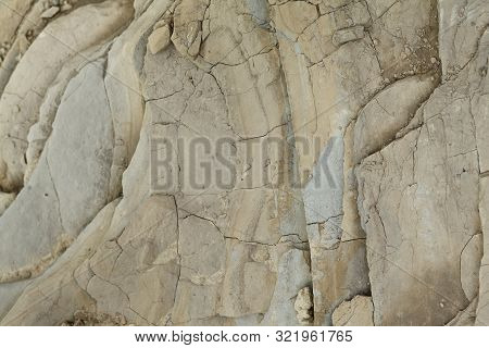 Small Pebbles On A Background Of Rough Rock