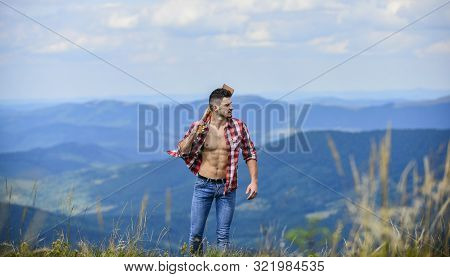 Carefree Wanderer. Conquer The Peaks. Man Hiker With Guitar Walking On Mountain. Guy Hiker Enjoy Pur