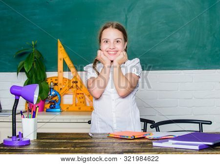 Knowledge Day. Girl Cute Child Sit School Classroom Chalkboard Background. Hooked On Learning. Homet