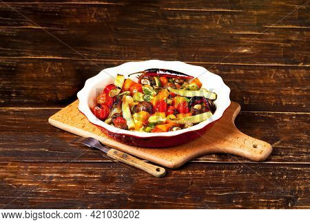 Grilled Mushrooms And Vegetables In Ceramic Bowl On Wooden Background.environmentally Friendly Menu 