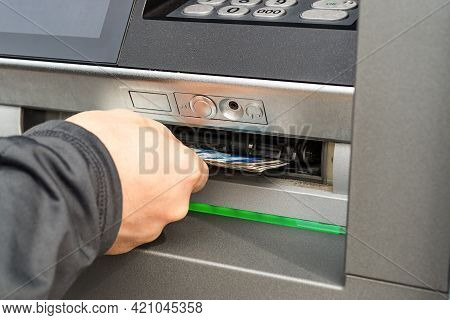 Caucasian Person Hand Receiving Banknotes From Atm Machine. Outdoor Cash Withdrawal On A Day. Bulgar