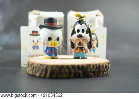 Samut Prakan, Thailand - May 20, 2021 : Cute Figurine Goofy And Scrooge Mcduck (mickey Mouse Family 