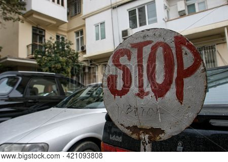 Azerbaijan, Baku - Nowember 2009: Stop Road Sign On A City Street Near Residential Buildings.