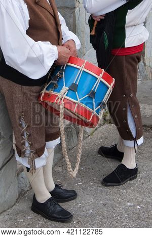 Two Men Dressed With Traditional Asturian Costumes With A Drum. Celebration In Asturias, Spain
