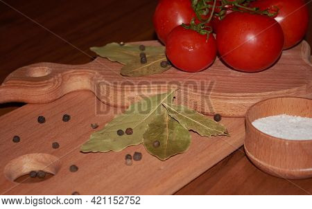 Fresh Red Tomatoes And Quail Eggs Lie On The Hay