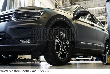 Moscow Russia-may 20 2021: Luxury Black Suv Car In A Car Service Station. In The Background, The Int