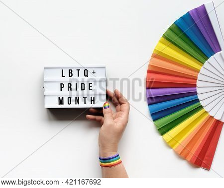 Lgbtq Pride Month Decor. Text Happy Pride Month On Lightbox. Rainbow Pattern Fan On Off White Backgr