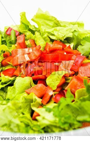 Fresh Raw Green Healthy Lettuce Salad In Glass Plate, Isolated On White Background