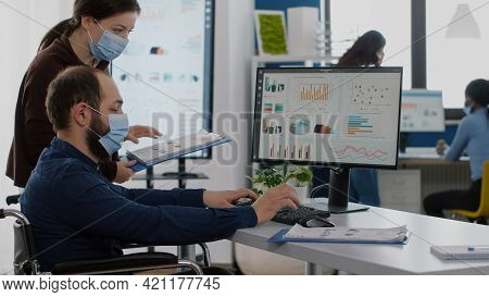 New Disabled Paralysed Invalid Employee Company Staff Member With Face Mask Look At Computer Asking 